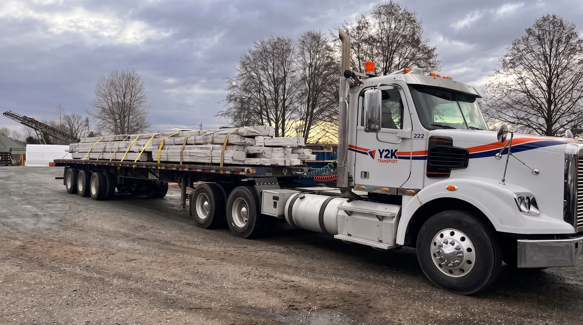Y2K Transport flatbed loaded with banded lumber
