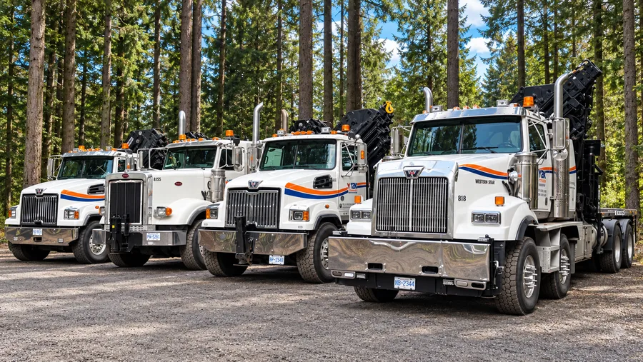Four Y2K Transport HIAB crane trucks lined up